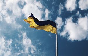A Ukrainian flag waving in the wind.